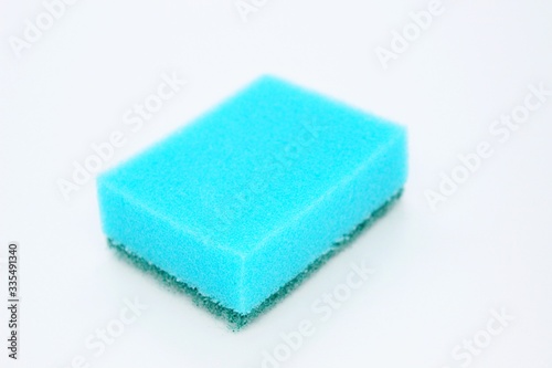 Multi-colored dishwashing sponges are placed on a white background