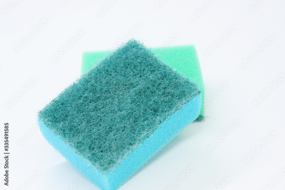 Multi-colored dishwashing sponges are placed on a white background Multi-colored dishwashing sponges are placed on a white background