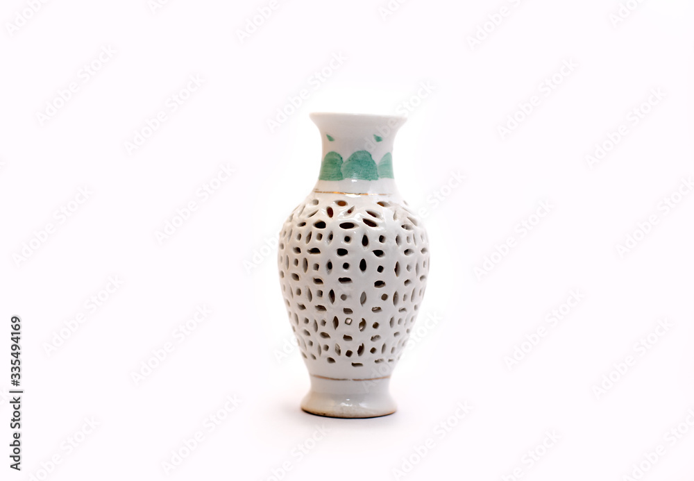 Traditional decorated mini mud pot on white background