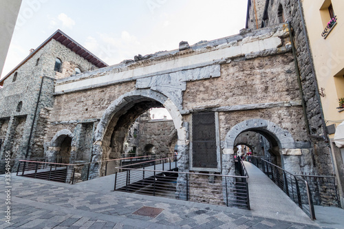 stone arch of Porta Praetoria in Aosta, ancient city gate. Aosta Valley, Italy