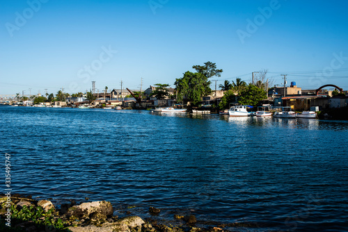 A Caribbean port, a poor city, an intense blue sea.