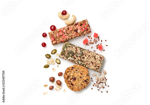 Granola bar with nuts and dry fruit berries. Energy cereal healthy snack. Fitness diet food. Protein muesli bars isolated on white background. Sport oatmeal bar, top view