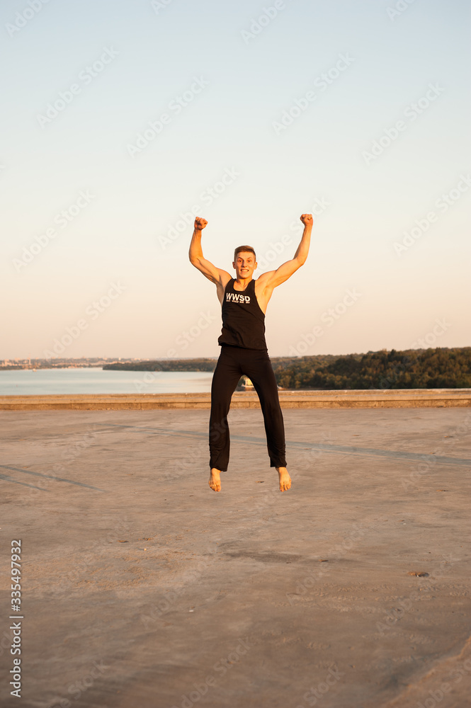 man dancer while dancing in the summer outdoors man dancer while dancing in the summer outdoors