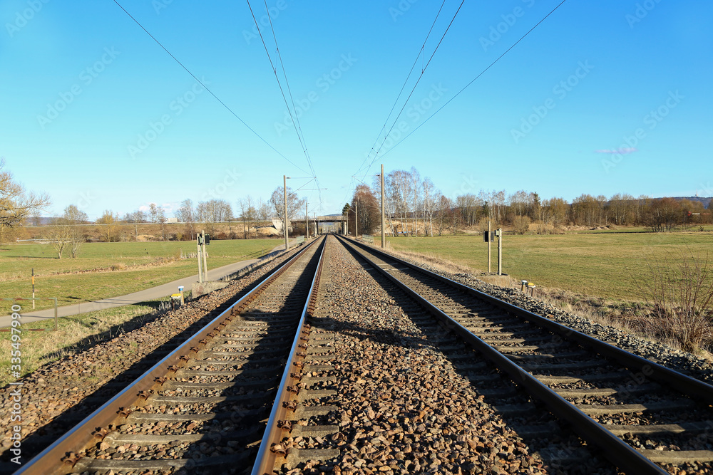 Railway stretching into the distance of fields