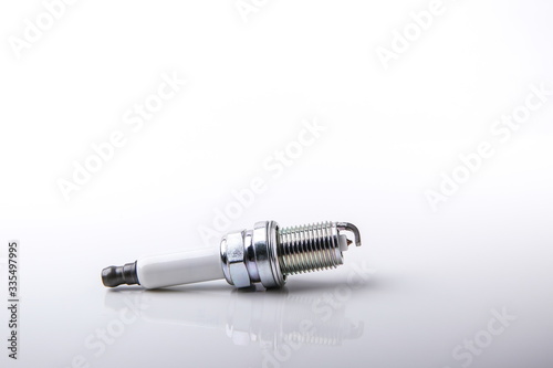 spark plug on white background with copy space 