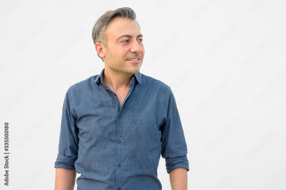 Portrait of happy mature handsome businessman thinking Portrait of happy mature handsome businessman thinking
