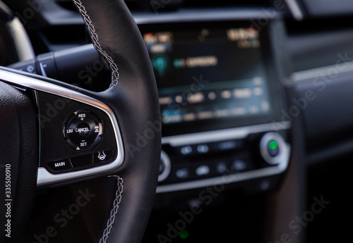 Buttons on steering wheel in interior of a car