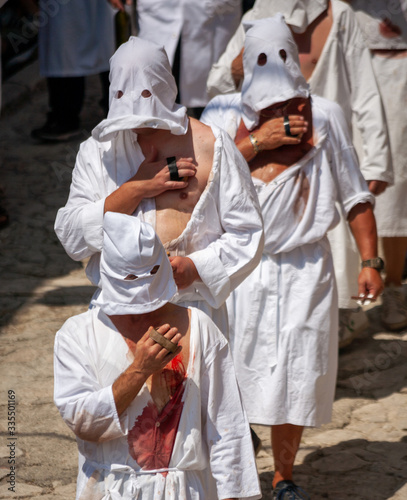 hooded men (battenti) beat their chest with a sponge with a nail, losing blood during septennial rites of penance, rituals in honor of Our Lady in Guardia Sanframondi, Benevento, Italy
