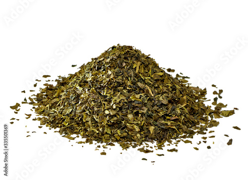 Dried green tea leaves pile isolated on white background