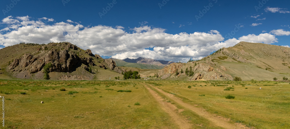 Altai landscape in summer with a road and mountains, Russia, June