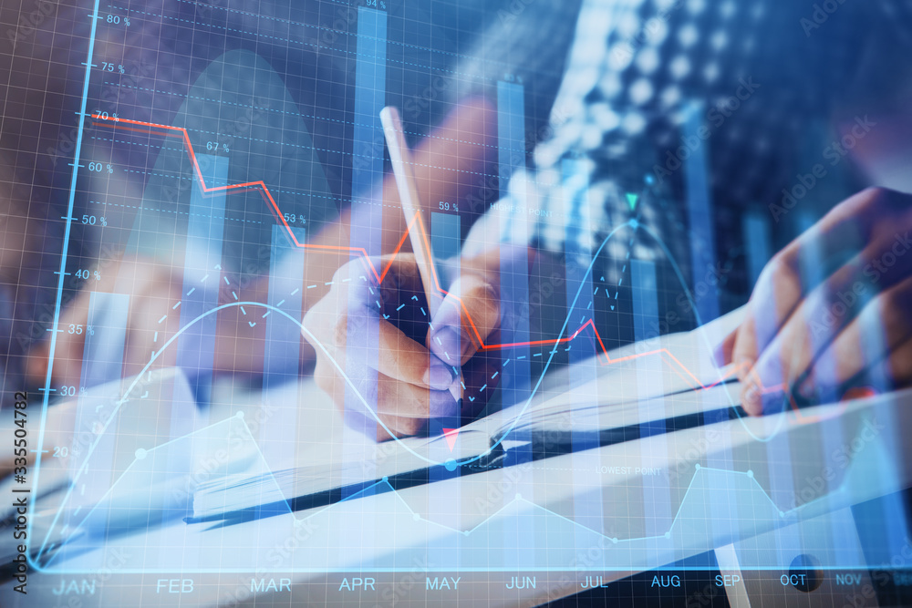 Multi exposure of two men planing investment with stock market forex chart. Multi exposure of two men planing investment with stock market forex chart.
