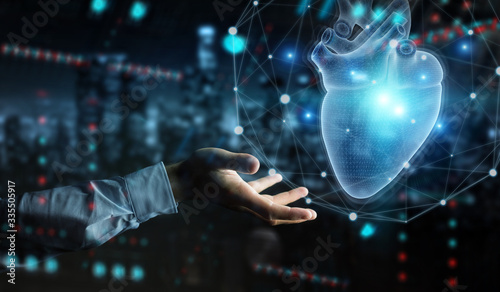 Photos Man hand using digital x-ray of human heart holographic scan projection 3D rende