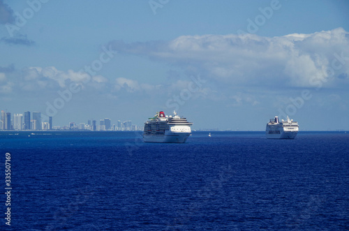 Cruiseships or cruise ship liners parked or anchored or laid up at sea in Miami Beach Florida due to Corona Virus disease or pandemic Covid-19 outbreak, a major crisis for Tourist industry