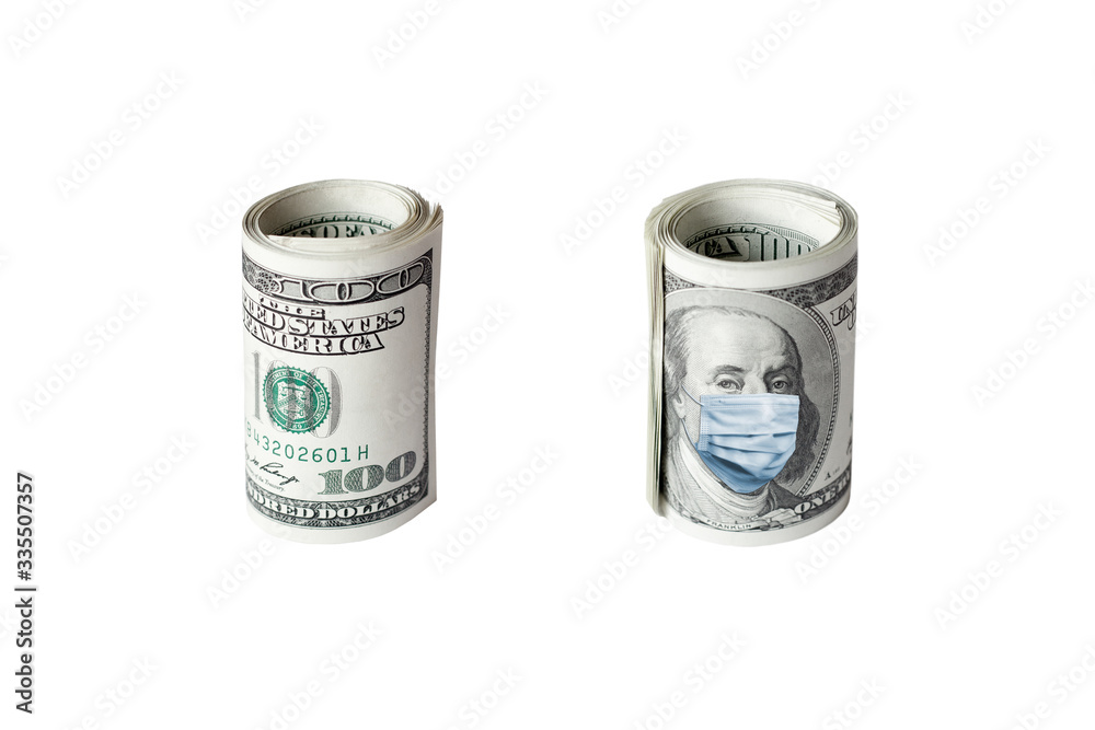 COVID-19 coronavirus in USA. Roll of hundred dollars money bill with face mask. COVID-19 coronavirus in USA. Roll of hundred dollars money bill with face mask.
