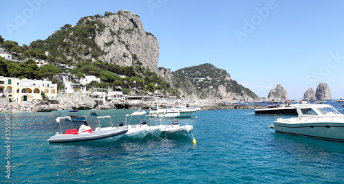 Capri, Italy- view of the Marina Piccola from the water with famous the Faraglioni rock stacks.