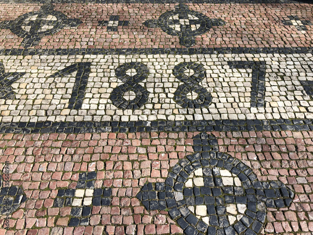 Cobblestone street with the date 1887 formed out of stones