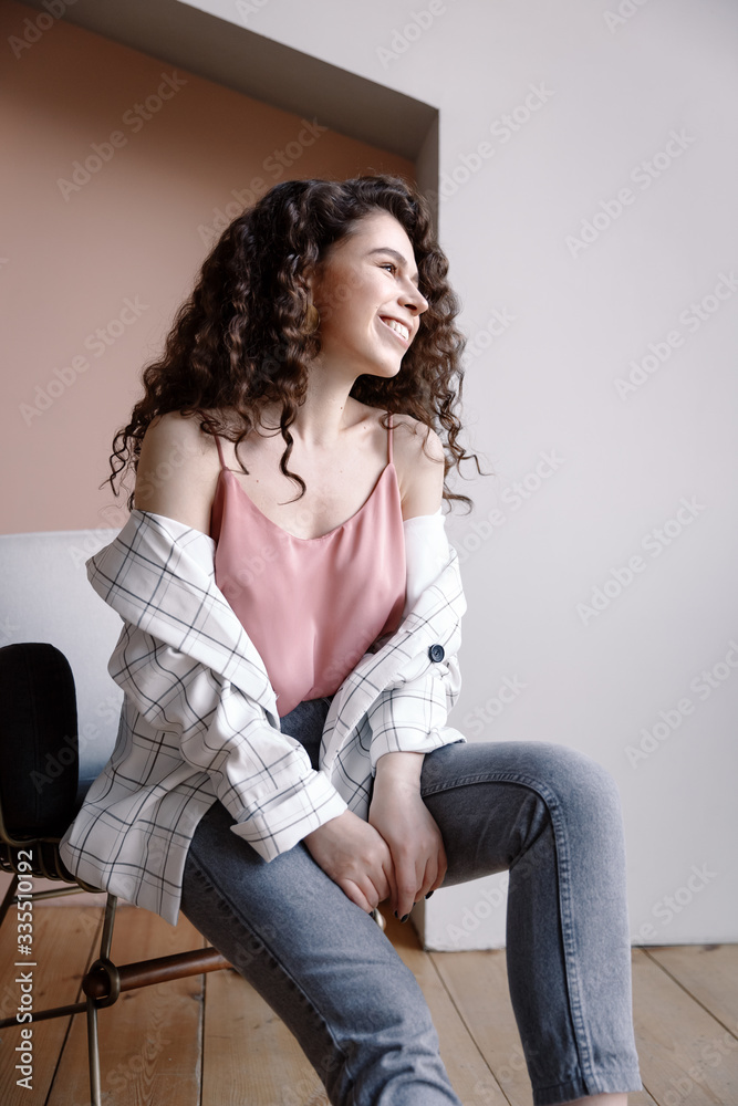 Young beautiful woman with curly hair Young beautiful woman with curly hair