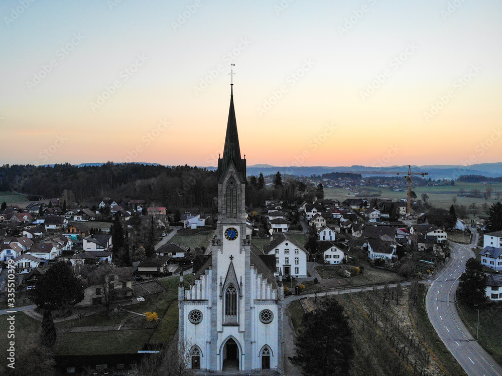 Fototapeta premium swiss church with sunrice