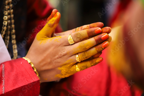 Indian wedding photography, Haldi ceremony groom hands