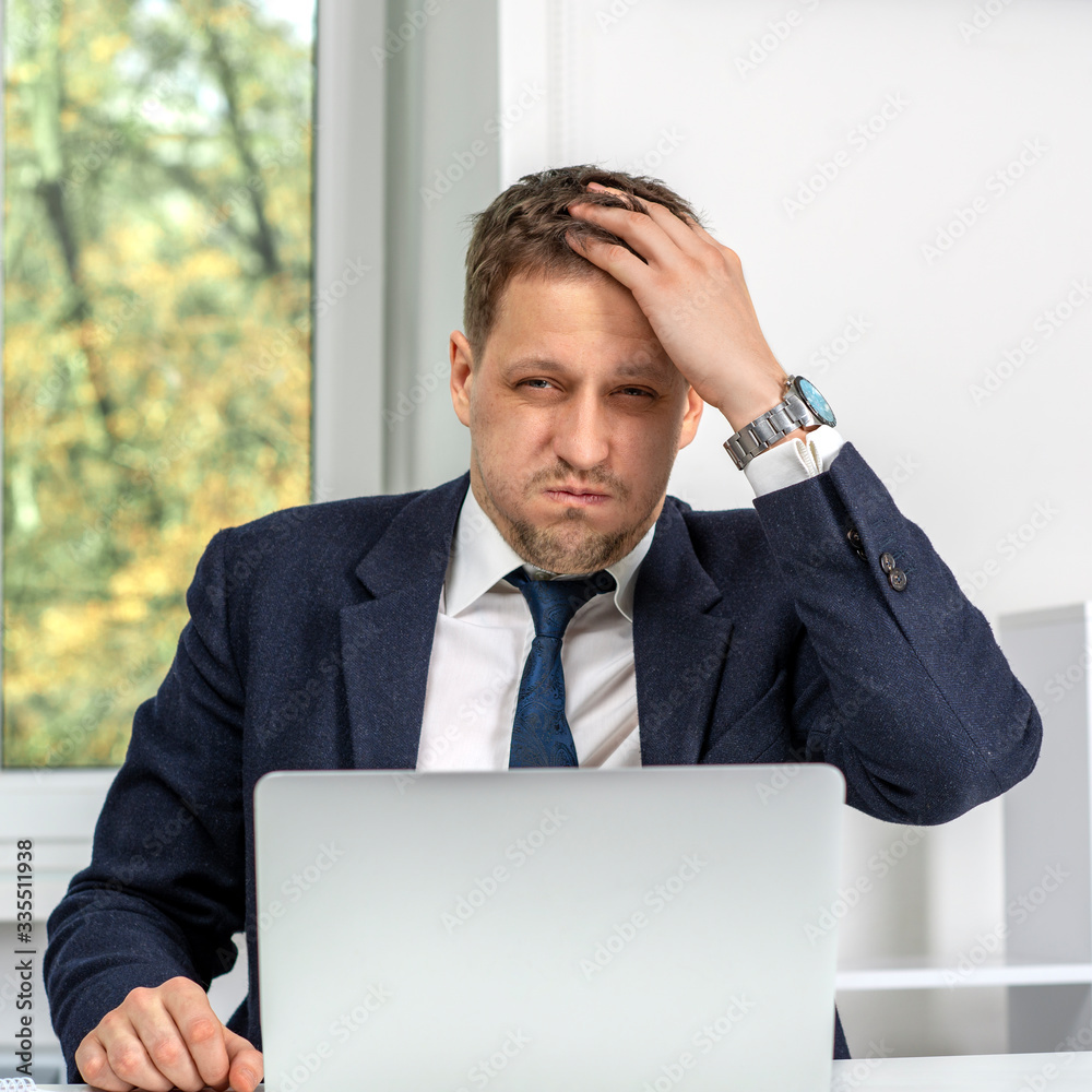 Shot of a young businessman having stress at work. Shot of a young businessman having stress at work.