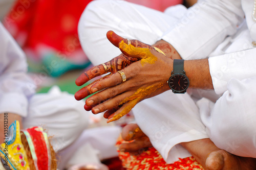 Indian wedding photography, Haldi ceremony groom hands