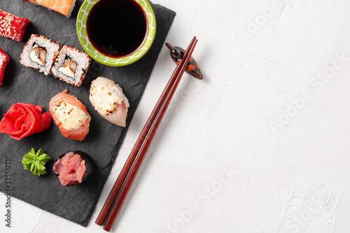 Obraz na płótnie Japanese cuisine. Assorted sushi maki gunkan roll on white table w salonie