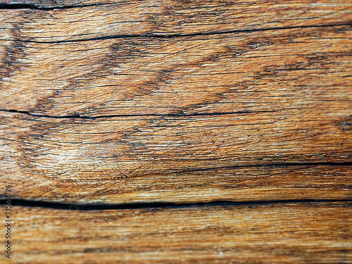 Old vintage planked wood board. Selective focus, blurred.