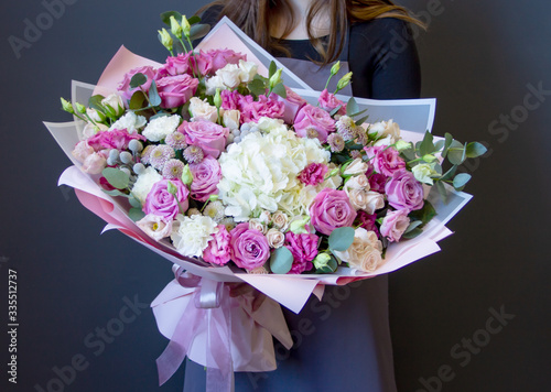 Fresh composition of bright flowers close-up work of florist decorative background