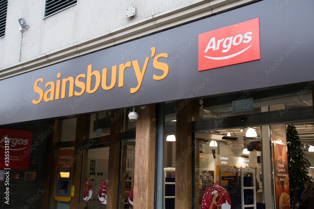 London- Sainsbury's supermarket exterior with Argos logo, British ...