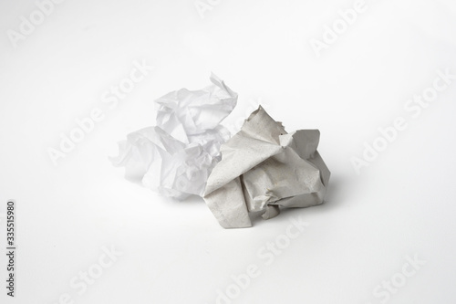 Used crumpled and squeezed paper ball isolated white background
