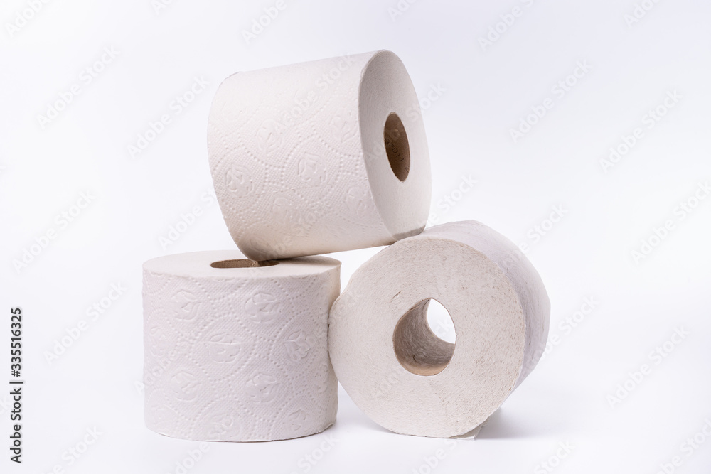 Three toilet paper rolls piled up on white background Three toilet paper rolls piled up on white background
