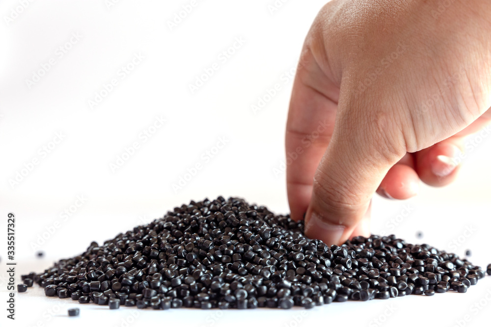 Close-up of plastic polymer granules. hand hold Polymer pellets. polymer plastic. compound polymer. Close-up of plastic polymer granules. hand hold Polymer pellets. polymer plastic. compound polymer.
