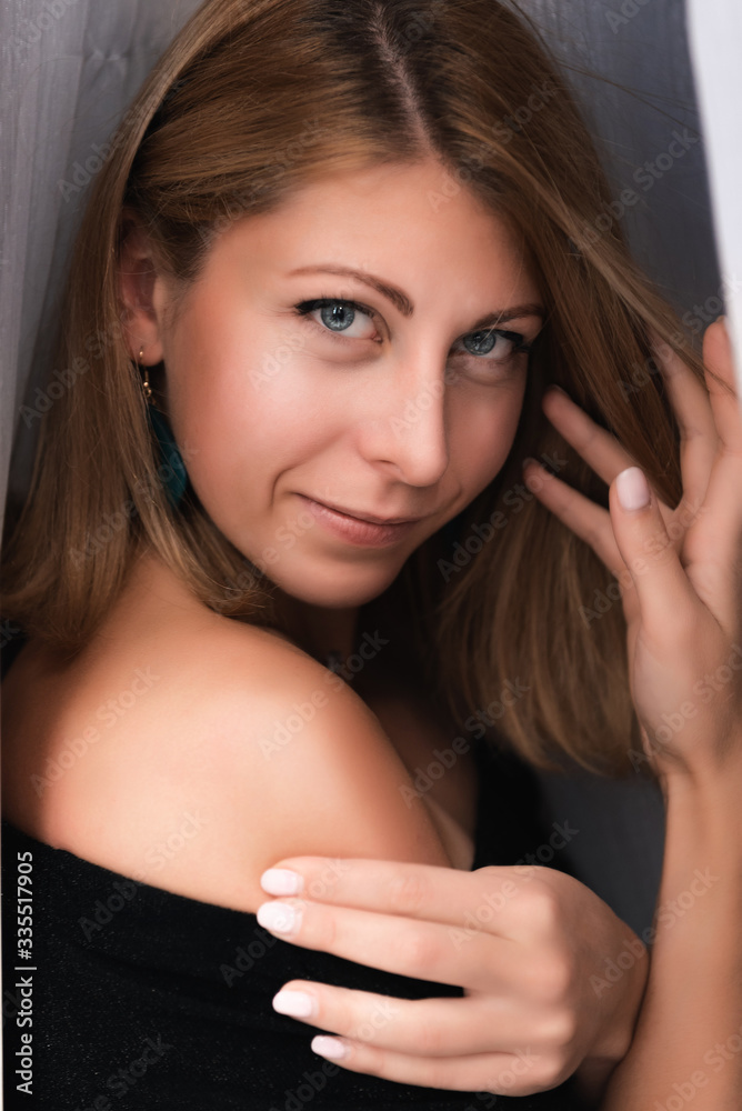 portrait of a smiling girl in a little black dress portrait of a smiling girl in a little black dress