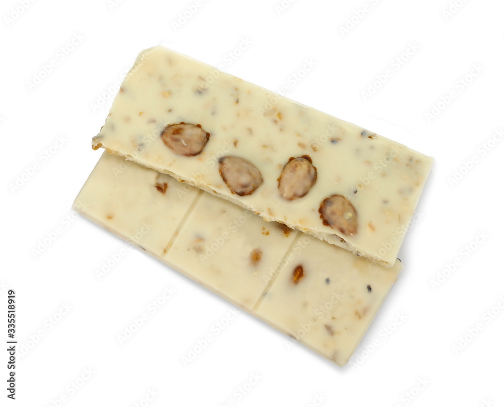 White chocolate pieces with pistachios and almonds isolated on white background.