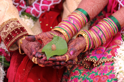 Traditional indian wedding ceremony, groom holding hand in bride hand © Neha