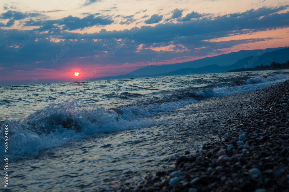 Naklejka premium beautiful sunset by the sea