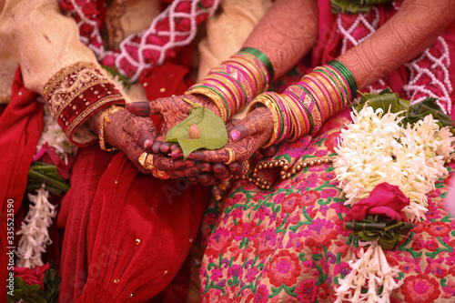Traditional indian wedding ceremony, groom holding hand in bride hand © Neha