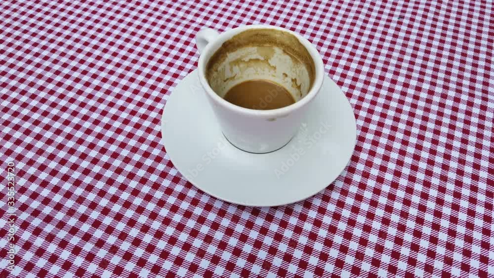 Cup of cappucino coffee on table with red sheet. time for caffee.