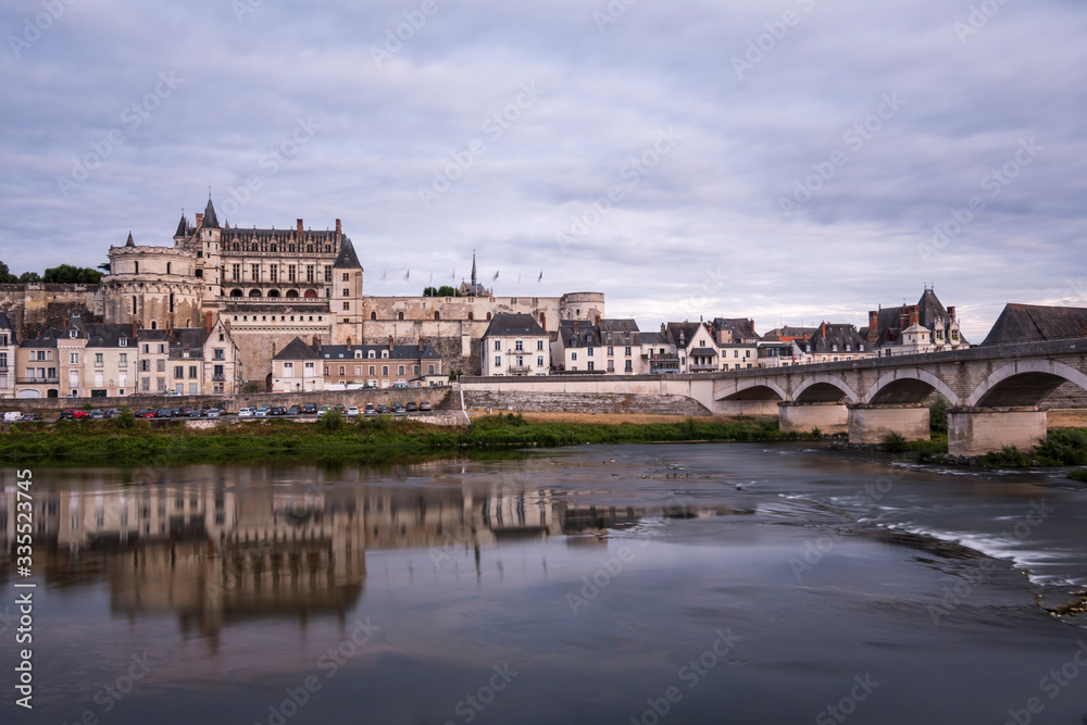 Aboise city on the Loire river with its castle on a summer night. (France)