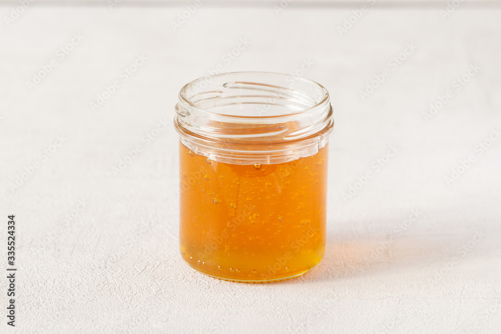 Honey jar or pot isolated on grey background. Honey jar or pot isolated on grey background.