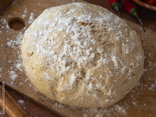 Pizza yeast dough lying on a cutting board