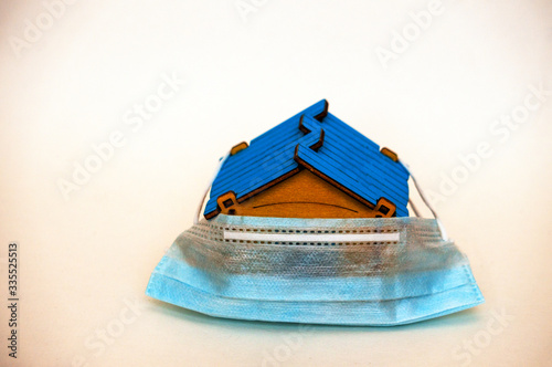 house with a ruble sign, on a white background, sitting at home, quarantine in Russia