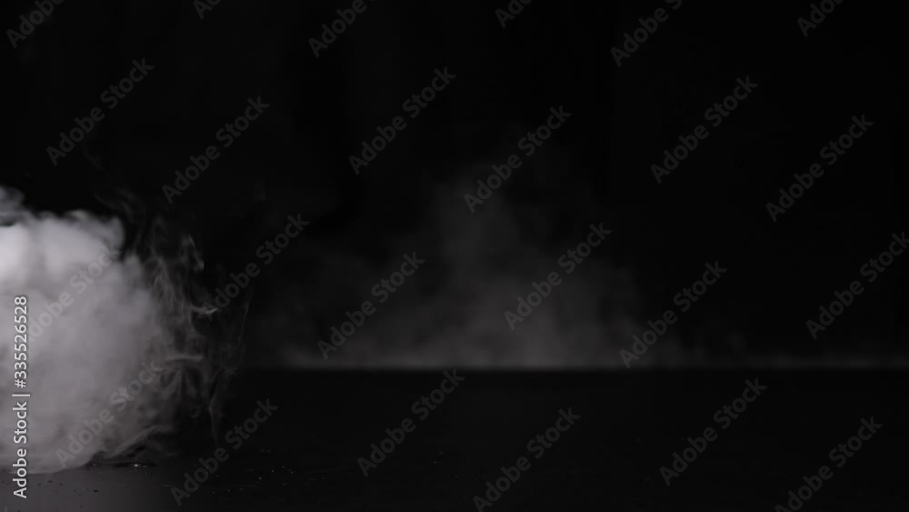 Smoke in slow motion on black background