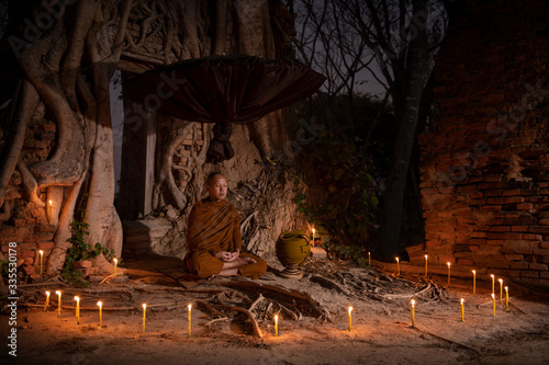 The monks sit in meditation to calm the body and mind which makes life happy.