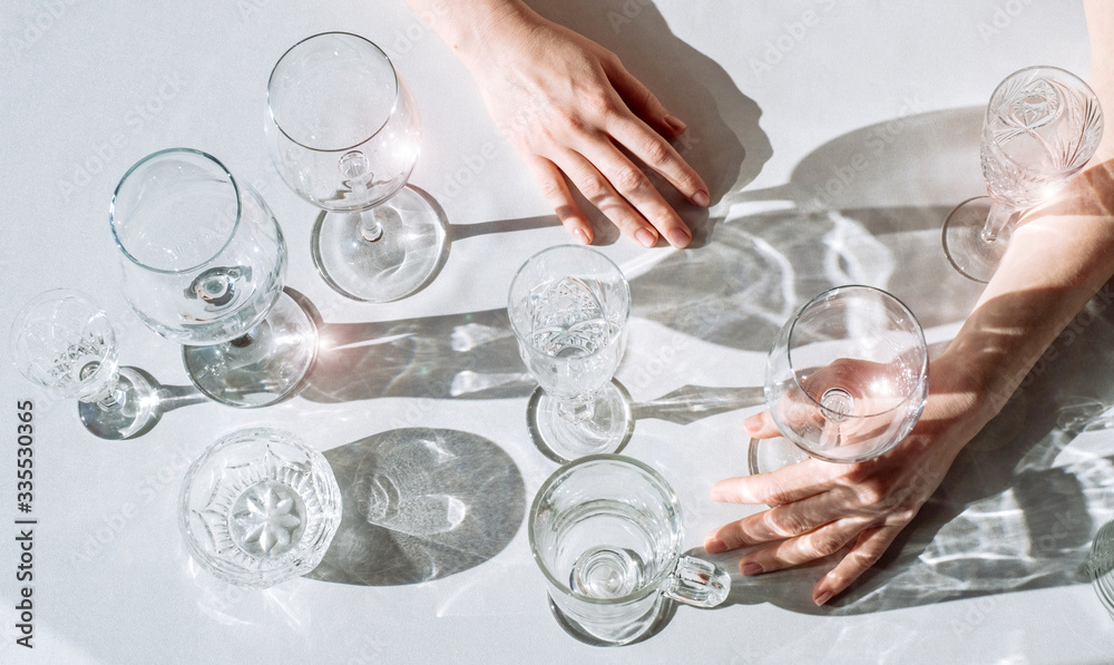 wine glasses sunlight shadow sun wine different glare hand woman white black background wine glasses sunlight shadow sun wine different glare hand woman white black background