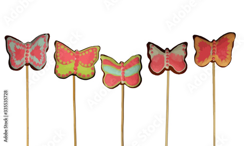 Graphic image of toppers made of gingerbread butterflies on a white background