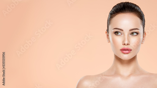 Vászonkép Beautiful face of young woman with health fresh skin