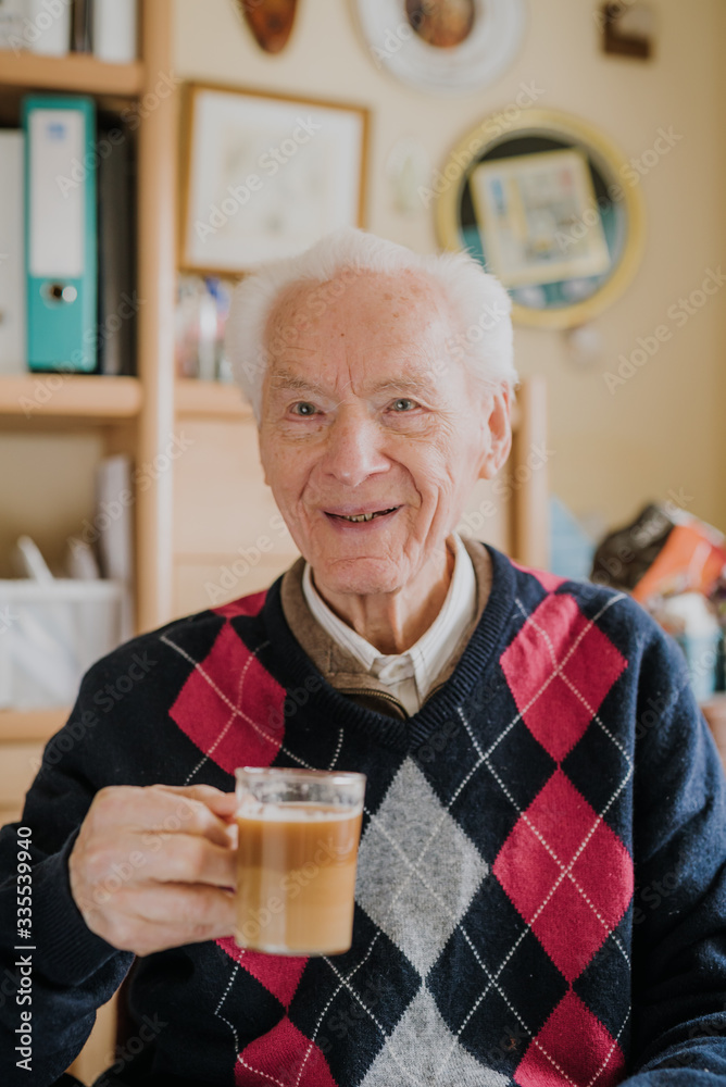 Old man drinking coffee at home Old man drinking coffee at home