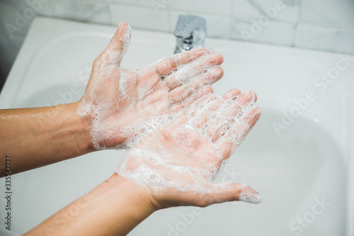 Close up Male hands washing hands with soap. for corona virus prevention.