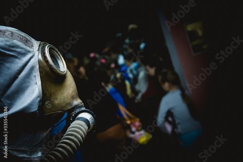 A gas mask with a crowd in the background